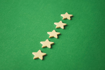 Fototapeta premium five white stars on a green background