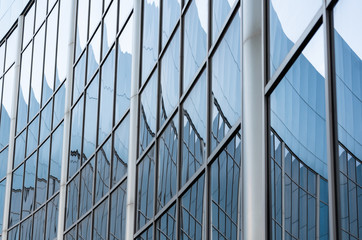 abstract background reflected in the glass windows of the building