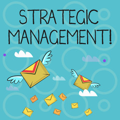 Obraz premium Conceptual hand writing showing Strategic Management. Concept meaning formulation and implementation of the major goals Colorful Airmail Letter Envelopes and Two of Them with Wings