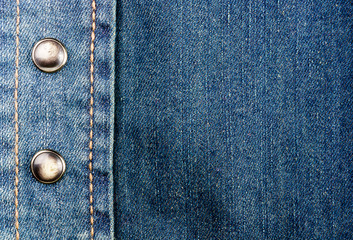 clothing items blue stonewashed faded jeans cotton fabric texture with seams, clasps, buttons and...