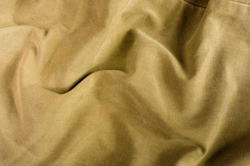 clothing items stonewashed cotton fabric texture with seams, clasps, buttons and rivets, macro