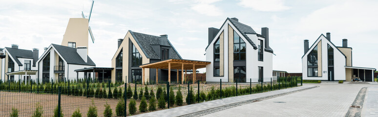 panoramic shot of street with new modern and luxury houses