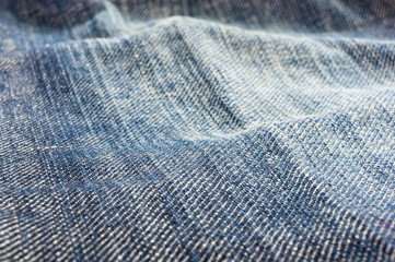 clothing items blue stonewashed faded jeans cotton fabric texture with seams, clasps, buttons and...