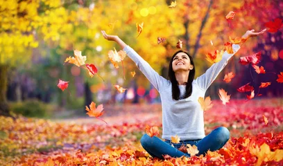 Foto op Canvas Happy Woman Enjoying Life in the Autumn on the Nature © Pasko Maksim 