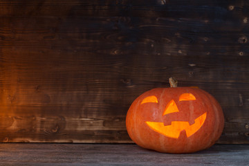 Halloween pumpkin on old wooden background
