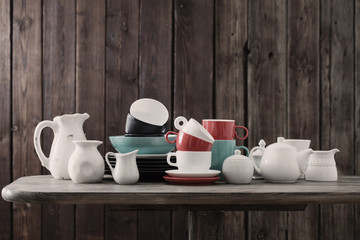 dinnerware on wooden background in kitchen
