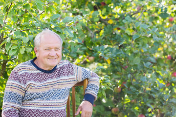 portrait of  elderly man in  garden