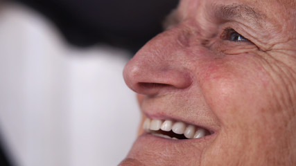 Closeup face of a elderly senior sad woman crying, cinematic dof