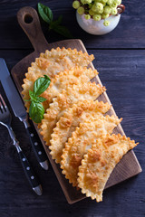 Chebureki - pan fried pie with meat and onions. Fried-dough food. View from above, top studio shot