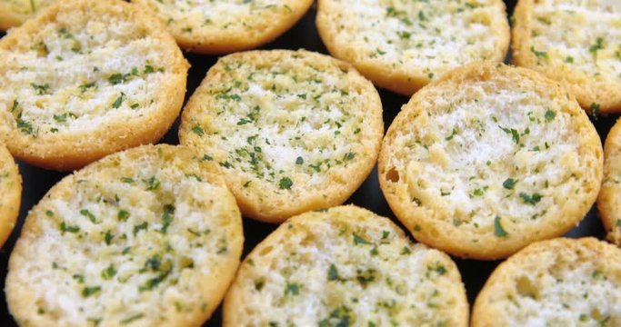 Slices of tasty garlic bread with herbs