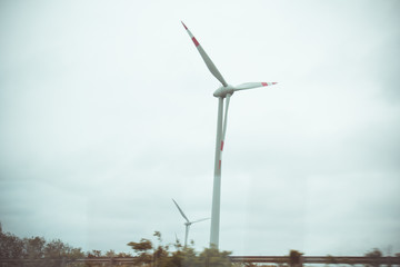 farm of wind electricity generators. alternative power from renewable energy. environmentally...