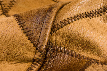 Old vintage genuine soft brown leather texture background, top layer with pores and scratches,...