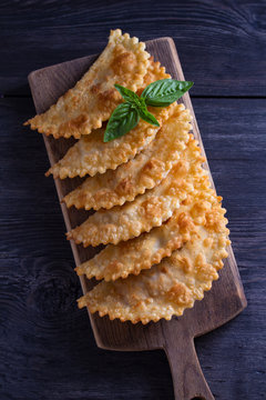 Chebureki - Pan Fried Pie With Meat And Onions. Fried-dough Food. View From Above, Top Studio Shot