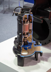 Cut-away view section parts inside submersible pump. Industrial manufacturer
