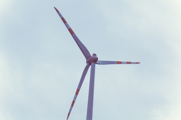 farm of wind electricity generators. alternative power from renewable energy. environmentally...