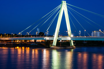 Fototapeta na wymiar Illuminated bridge accross the river Rhein in Cologne