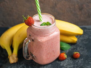 Strawberry banana smoothie in a glass jar. Very tasty Breakfast
