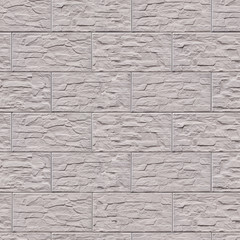 Artificial stone on the wall with a rough surface of brown .Background or texture