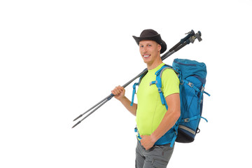 Young male tourist with nordic walking sticks and hiking backpack. - 274095653