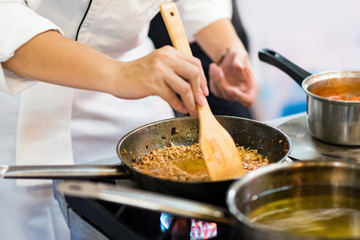 Chef preparing food in the kitchen, chef cooking