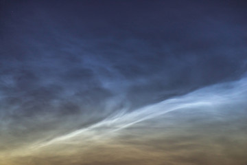 Obraz premium Noctilucent clouds closeup summer night.