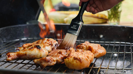 Roasted chicken drum stick, chest and sirloin beef with flame on charcoal stove