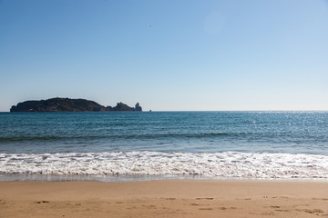 Fototapeta na wymiar Island view from the beach on sunny day - Medes Islands