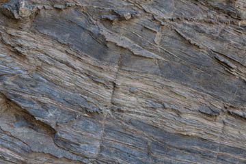 Textura de pedra natural. Superfície texturizada de rocha natural, onde se podem ver as linhas...