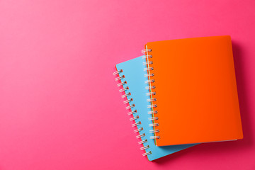 School copybooks on color background, space for text