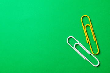 Clips on green background, space for text and closeup