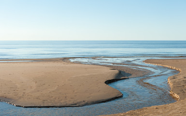 Beach and a creek on the seaside