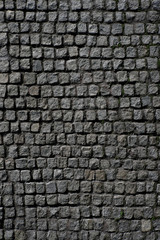 The texture of a square stone. Antique stonework. Pattern stone background