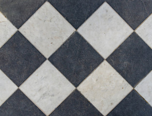 Black and white wintage checkered floor tiles.