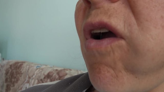 4K Mouth of woman eating noisily a piece of apple, audio