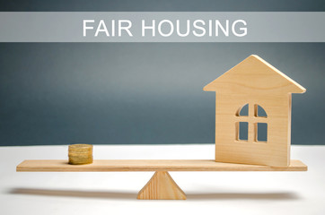Money and house on the scales with the inscription Fair housing. Home appraisal. Property...
