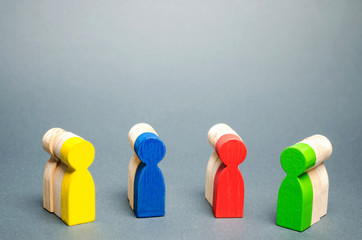 Groups of multicolored wooden people. The concept of market segmentation. Customer relationship...
