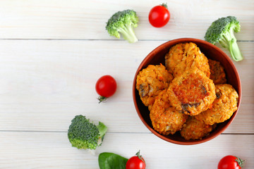 Chickpea cutlet and pasta on wooden board