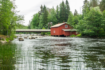 Fototapeta premium Old mill, dam and threshold on the river Jokelanjoki, Kouvola, Finland