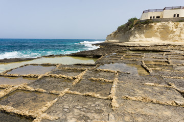 Salt evaporation ponds, also called Salterns or Salt Pans, on the Maltese island of Gozo