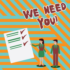 Writing note showing We Need You. Business concept for asking someone to work together for certain job or target Man and Woman Presenting Report of Check and Lines on Paper