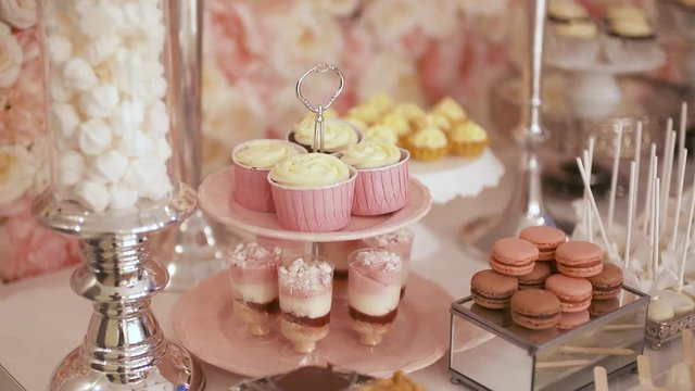 Cute candy bar with various cakes and candies. Wedding candybar.