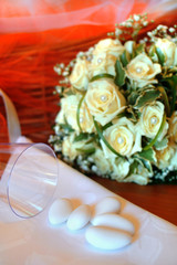 Close up of wedding  flowers bouquet and white confetti.