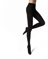Legs of sexy young caucasian woman in black nylon tights on white background