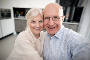 Cheerful senior couple taking selfie