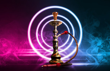 Hookah, smoke on a dark abstract background. Background of empty scenes with multicolored neon lights, reflection of night lights on wet pavement