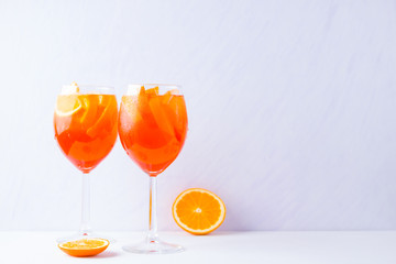 Cocktail Aperol Spritz with mint leaves on a white background. Italian cocktail aperol spritz on...