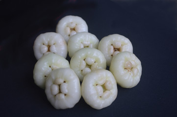 indian juicy summer fruit Java apple present on black background