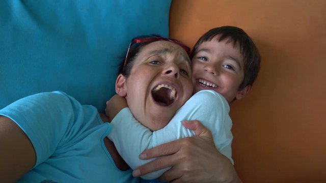 4K Selfie antic mother and child fool around on cushions