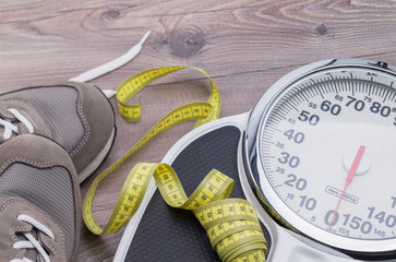 Tape measure, running shoes and weighing scales