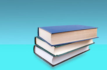 books stacked on top of each other